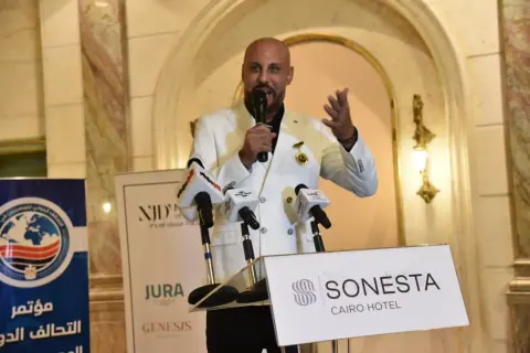 Girgis Youssef speaking at a press conference