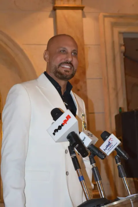 Girgis Youssef speaking to reporters